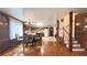 Kitchen and dining area featuring a staircase, chandelier, and eat-in area at 4083 Rivermeade Sw Dr, Lilburn, GA 30047