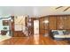 Living area showcasing hardwood floors, decorative wood panels, and staircase at 4083 Rivermeade Sw Dr, Lilburn, GA 30047
