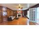 Elegant living room featuring hardwood floors, fireplace, custom built-ins, and a ceiling fan at 4083 Rivermeade Sw Dr, Lilburn, GA 30047