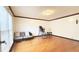 Spacious living room featuring gleaming hardwood floors and large windows at 4083 Rivermeade Sw Dr, Lilburn, GA 30047