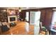 Spacious living room featuring a fireplace, hardwood floors, and a door to a sunroom at 4083 Rivermeade Sw Dr, Lilburn, GA 30047
