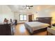 Spacious main bedroom with hardwood floors, abundant natural light, and a ceiling fan at 4083 Rivermeade Sw Dr, Lilburn, GA 30047
