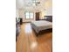 Spacious main bedroom with hardwood floors and a ceiling fan at 4083 Rivermeade Sw Dr, Lilburn, GA 30047