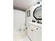 Well-lit bathroom features a white vanity with modern black fixtures and a shower with a curtain at 795 Hammond Dr # 407, Sandy Springs, GA 30328