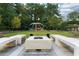 Modern outdoor fire pit surrounded by concrete benches in the community park-like setting at 795 Hammond Dr # 407, Sandy Springs, GA 30328