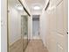 Hallway with carpet floor, mirrors, and multiple doors to other rooms at 795 Hammond Dr # 407, Sandy Springs, GA 30328