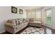 Inviting living room boasts a comfortable sectional sofa, plush rug, and lots of natural light at 795 Hammond Dr # 407, Sandy Springs, GA 30328