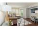 Relaxing living room showcasing a sectional sofa, stylish rug, and a large flat-screen television at 795 Hammond Dr # 407, Sandy Springs, GA 30328
