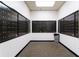 Mailroom featuring many individual black mailboxes against white walls at 795 Hammond Dr # 407, Sandy Springs, GA 30328