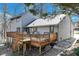 Cozy backyard deck with wooden railing, stairs, and space for outdoor seating and relaxation at 2715 Brook Valley Dr, Cumming, GA 30041