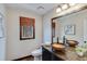 Bathroom featuring modern sink bowls and a decorative mirror adding style and functionality at 2715 Brook Valley Dr, Cumming, GA 30041