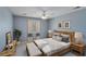Calm bedroom featuring soft blue walls, neutral bedding, and natural wood accents creating a peaceful retreat at 2715 Brook Valley Dr, Cumming, GA 30041