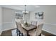 Dining room with a six seat dining table under a decorative light fixture at 2715 Brook Valley Dr, Cumming, GA 30041
