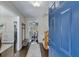 Inviting foyer showcasing wood floors and a blue door with views of dining room and staircase to the second floor at 2715 Brook Valley Dr, Cumming, GA 30041