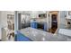 Close up of kitchen with stainless steel appliances, blue lower cabinets, white upper cabinets, and modern countertops at 2715 Brook Valley Dr, Cumming, GA 30041