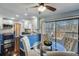 Eat-in kitchen area with stainless appliances, granite countertops, a glass top table, and a view to the deck at 2715 Brook Valley Dr, Cumming, GA 30041