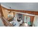 Cozy living room with wood paneling, stone fireplace, and natural light, creating a warm atmosphere at 2715 Brook Valley Dr, Cumming, GA 30041