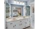 The main bathroom has a double sink vanity and is adjacent to the main bedroom at 2715 Brook Valley Dr, Cumming, GA 30041