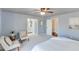 Relax in this beautifully decorated main bedroom, featuring neutral tones, soft carpet and an ensuite bathroom at 2715 Brook Valley Dr, Cumming, GA 30041