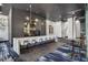 Elegant bar area featuring a long white counter, modern stools, and stylish lighting fixtures at 3324 Peachtree Ne Rd # 2807, Atlanta, GA 30326