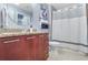 Well-lit bathroom with a granite countertop vanity and a shower with white shower curtain at 3324 Peachtree Ne Rd # 2807, Atlanta, GA 30326