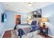 Cozy bedroom featuring a comfortable bed, hardwood floors, and a walk-in closet at 3324 Peachtree Ne Rd # 2807, Atlanta, GA 30326