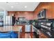 Gourmet kitchen features stainless appliances, dark backsplash, and central island for meal preparation at 3324 Peachtree Ne Rd # 2807, Atlanta, GA 30326