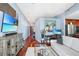 Cozy living space with hardwood floors, modern furniture, and a view into the well-equipped kitchen at 3324 Peachtree Ne Rd # 2807, Atlanta, GA 30326