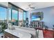 Inviting living room with floor-to-ceiling windows, hardwood floors, and upscale furnishings, bathed in natural light at 3324 Peachtree Ne Rd # 2807, Atlanta, GA 30326