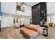 A modern lobby with a large sofa, high ceilings, built-in shelving, and a cozy fireplace at 3324 Peachtree Ne Rd # 2807, Atlanta, GA 30326