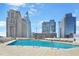 Rooftop pool with lounge chairs and umbrellas, offering stunning city skyline views at 3324 Peachtree Ne Rd # 2807, Atlanta, GA 30326