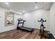Finished basement area with workout equipment and laminate wood flooring at 3790 Narmore Ne Dr, Atlanta, GA 30319