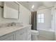 Clean bathroom with white vanity, marble countertop, and subway tiled shower/tub at 3790 Narmore Ne Dr, Atlanta, GA 30319