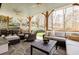 Spacious covered patio featuring a cozy seating area, dining table, and scenic views at 3790 Narmore Ne Dr, Atlanta, GA 30319
