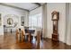 Bright dining room featuring hardwood floors, a large window, and traditional furnishings, offering a cozy and elegant space at 3790 Narmore Ne Dr, Atlanta, GA 30319