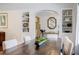 Elegant dining room with a large wooden table, built-in shelving, and sophisticated decor for hosting guests at 3790 Narmore Ne Dr, Atlanta, GA 30319