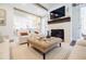 Inviting living room featuring a fireplace, comfortable seating, and a seamless transition to the outdoor space at 3790 Narmore Ne Dr, Atlanta, GA 30319