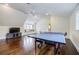 Bonus room features hardwood floors, window seat, and ping pong table at 3790 Narmore Ne Dr, Atlanta, GA 30319