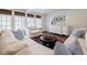 Cozy living room with neutral decor, built-ins, and three large windows at 3790 Narmore Ne Dr, Atlanta, GA 30319