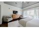 Main bedroom boasting vaulted ceilings, balcony access, and stylish furnishings, offering a comfortable and elegant space at 3790 Narmore Ne Dr, Atlanta, GA 30319
