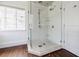 Modern shower with glass door, pebble floor, and white subway tile at 3790 Narmore Ne Dr, Atlanta, GA 30319