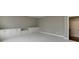 Neutral bedroom features built in shelving for storage with neutral color walls at 4296 Alba Ln, Buford, GA 30519