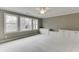 Bright bedroom features neutral carpet, large windows, and a ceiling fan with lots of storage at 4296 Alba Ln, Buford, GA 30519