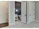Bedroom with attached bathroom featuring stylishly wallpapered walls at 4296 Alba Ln, Buford, GA 30519
