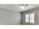 The serene bedroom has plantation shutters, a ceiling fan and neutral walls at 4296 Alba Ln, Buford, GA 30519