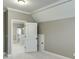 A view from a bedroom to a bathroom featuring a frameless shower and herringbone floors at 4296 Alba Ln, Buford, GA 30519