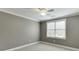 Bright bedroom featuring a ceiling fan and large window, creating a comfortable space at 4296 Alba Ln, Buford, GA 30519