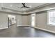 Bonus room with recessed lighting, neutral walls, door to patio, and view into the kitchen at 4296 Alba Ln, Buford, GA 30519