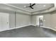 Neutral bonus room with recessed lighting, neutral walls, and view into the kitchen at 4296 Alba Ln, Buford, GA 30519