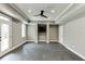Large bonus room with recessed lighting, neutral walls, dark floors, and access to a patio at 4296 Alba Ln, Buford, GA 30519